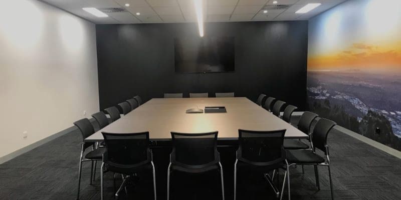 Clean modern meeting room with conference table and formal business setup